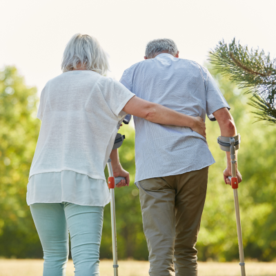 Elderly couple with walkers